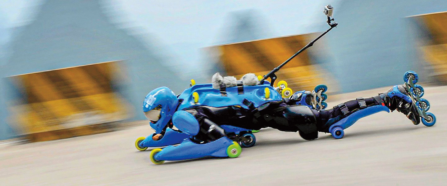 Jean-Yves Blondeau speeds down a track in his roller suit.