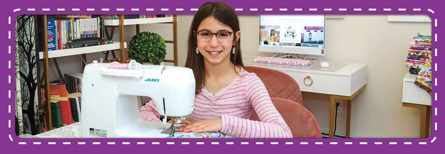 Guiliana smiles with her sewing machine.