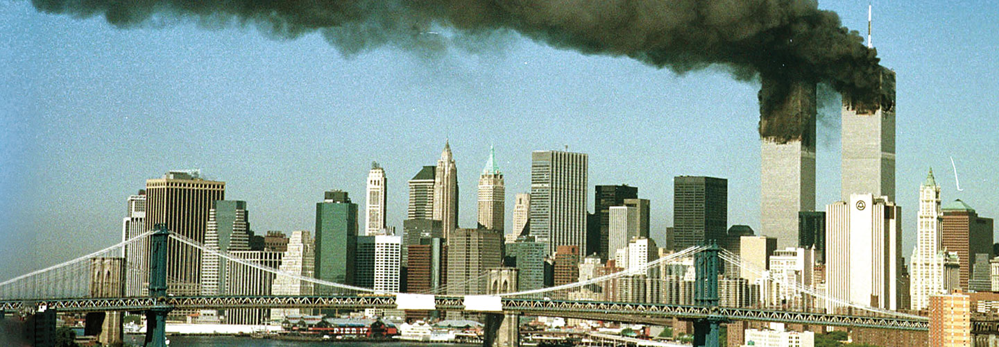 A distant view of the Twin Towers in New York on fire the day of September 11th
