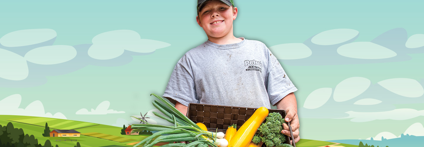 Kid holding a crate of fresh produce with an illustration of a farm in the background