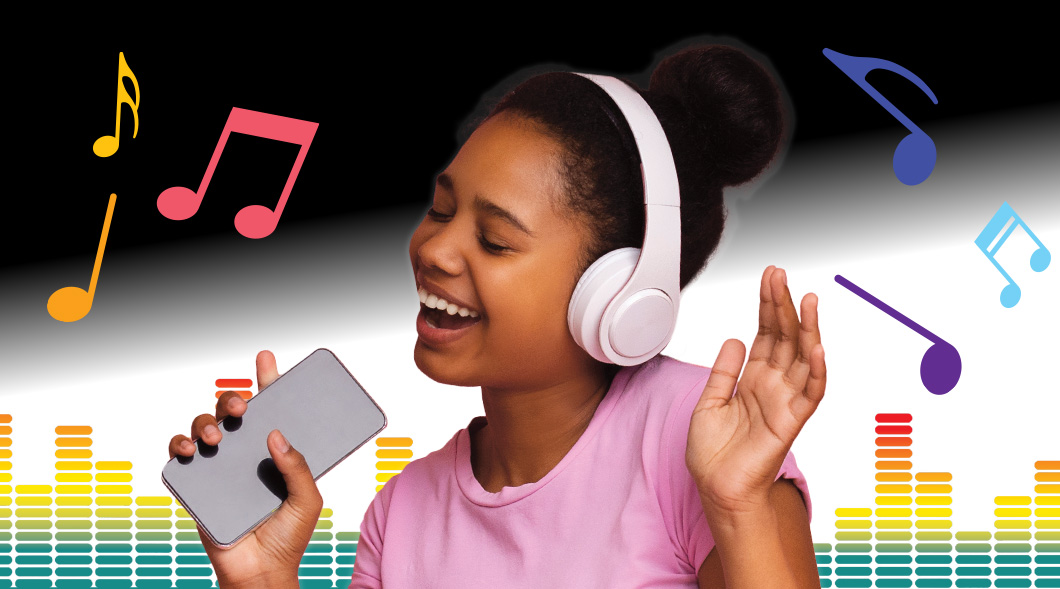 Photo of a kid wearing headphones, holding phone, and dancing