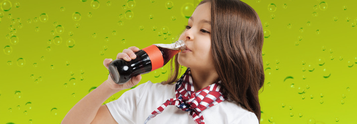 Photo of a kid drinking soda