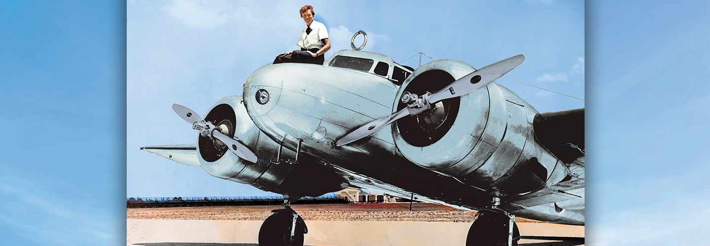 Colorized image of Amelia Earhart posing on top of a plane