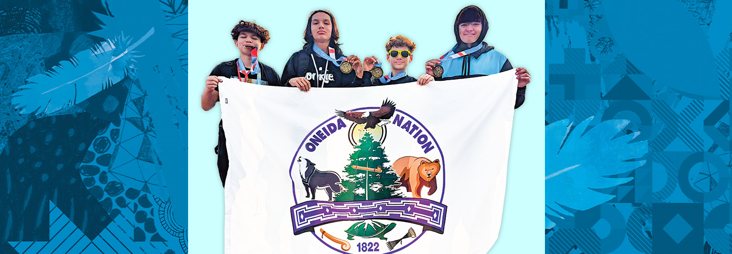Image of four kids holding up banner. Text, "Oneida Nation"